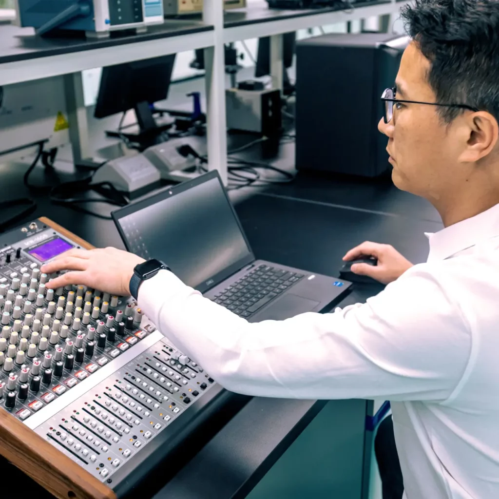 A Ryder Industries engineer testing an audio mixing console.