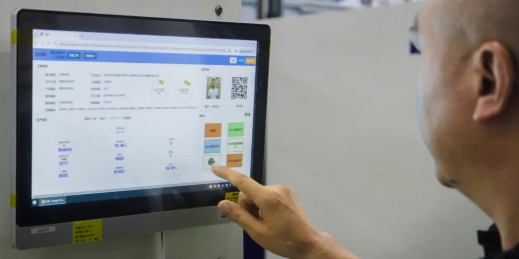 Close-up of a technician using a data pad.